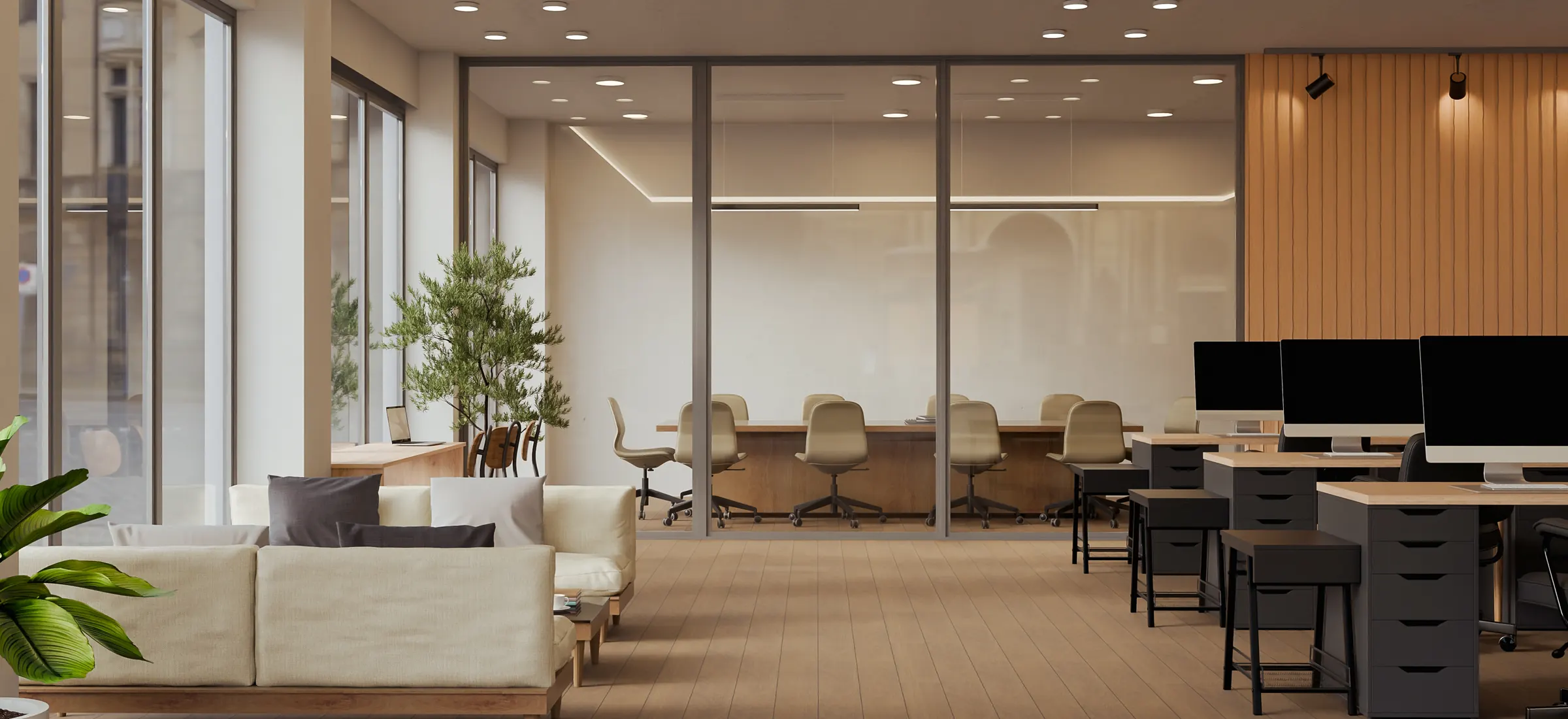A bright modern office with a glass-walled conference room